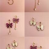 A grid of six images shows three pairs of gold-plated and purple bow earrings, each arranged front and back on a soft pink background. Some earrings feature freshwater pearl or chain accents for a refined touch.